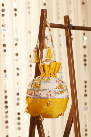 mustard chanderi potli with pearl and crystal hangings