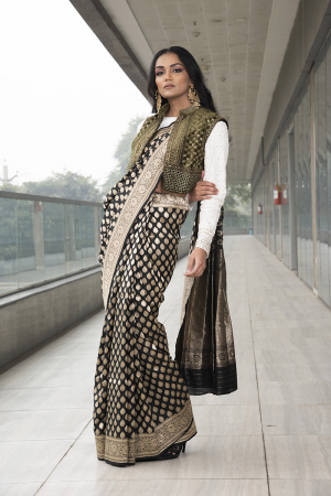 black pure katan silk saree. paired with ivory embroidered blouse  velvet jacket.