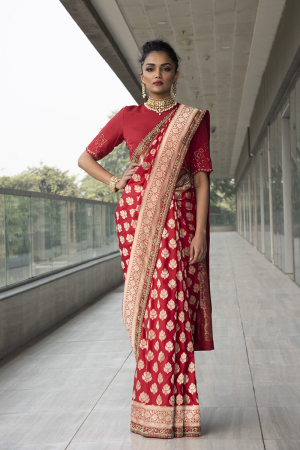 Red pure katan silk saree with red crop blouse with scalloped embroidery.