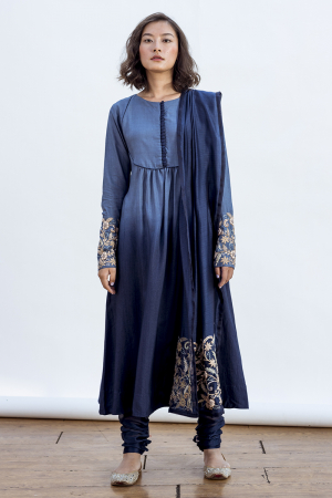 Susan kurta with a round yoke and emrboidery on sleeves and dupatta. features a churidaar  style pant.