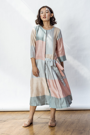 Phoebe front open dress with front opening, a pleated panel and one side tie up