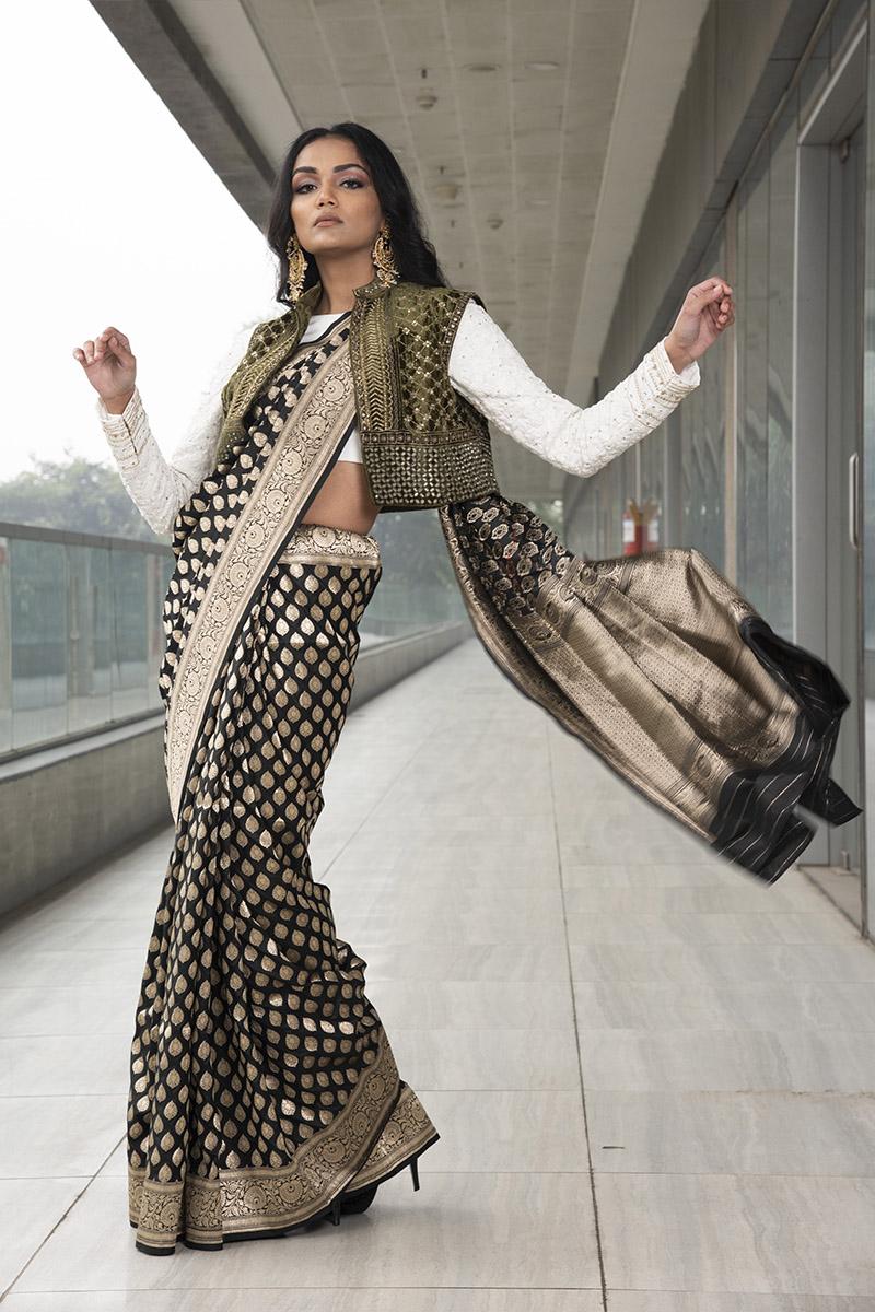 black pure katan silk saree. paired with ivory embroidered blouse  velvet jacket.