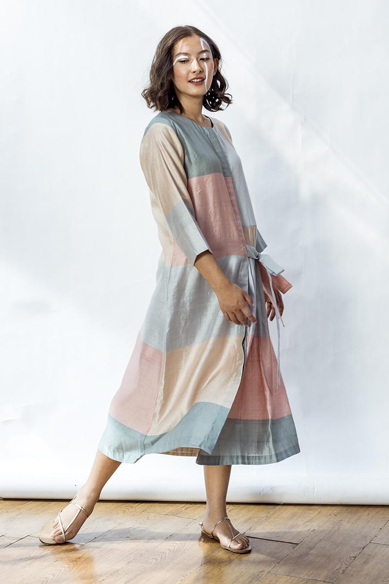 Phoebe front open dress with front opening, a pleated panel and one side tie up