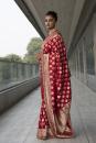 Red pure katan silk saree with red crop blouse with scalloped embroidery.